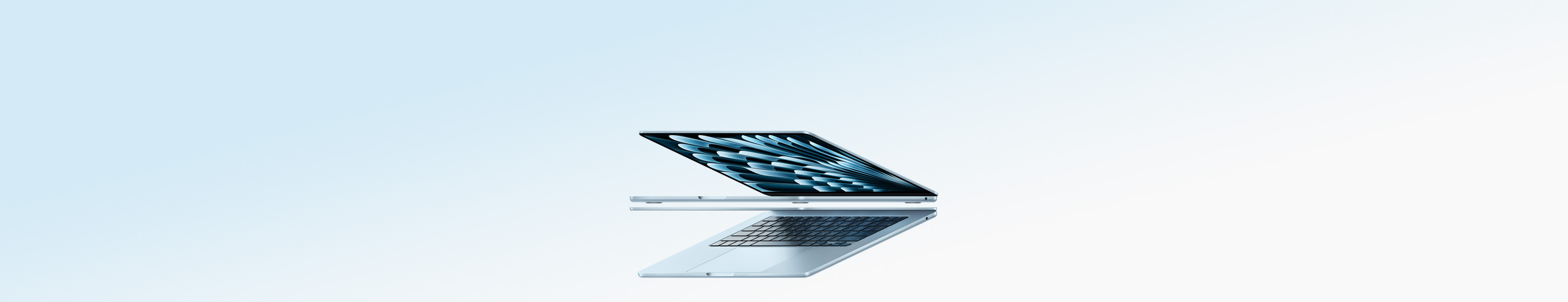 Two open MacBook Air laptops in sky blue colour forming arrow shape, emphasizing narrow profile